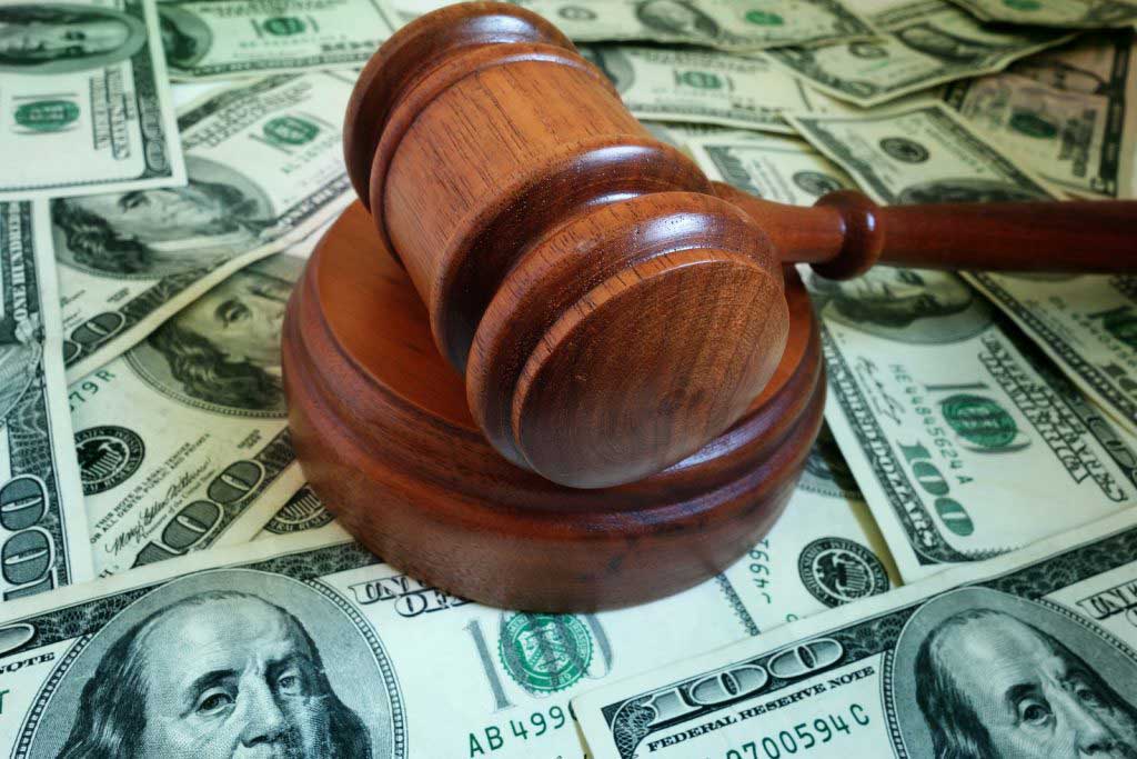 Macro gavel with money symbolizing fiduciary case in Milwaukee