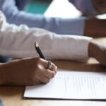 Person filling out paperwork_s