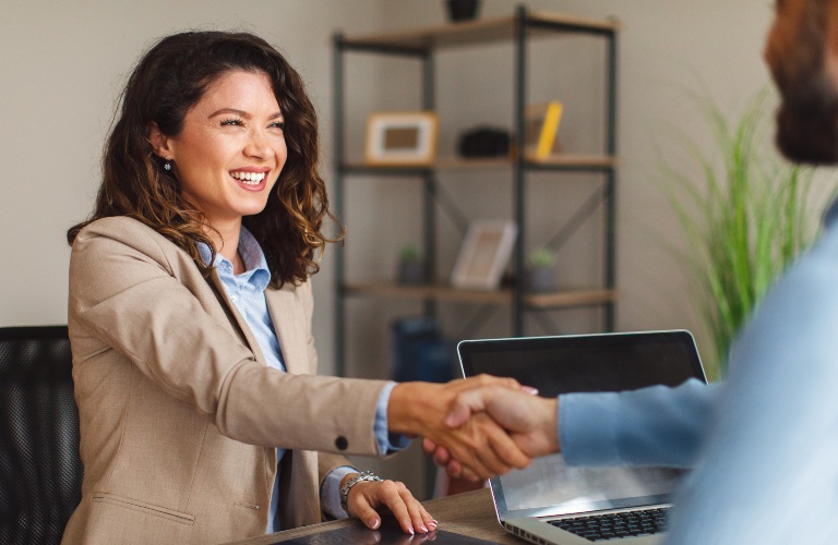 business woman shaking a man's hand