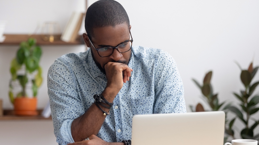 man thinking at computer_s