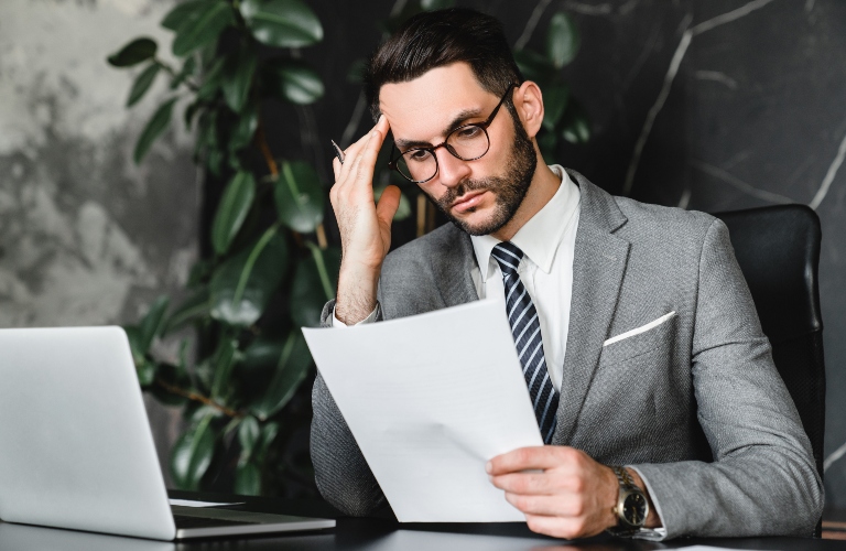 stressed businessman checking documents
