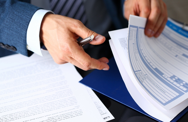man is working with documents