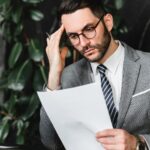 stressed businessman checking documents_s