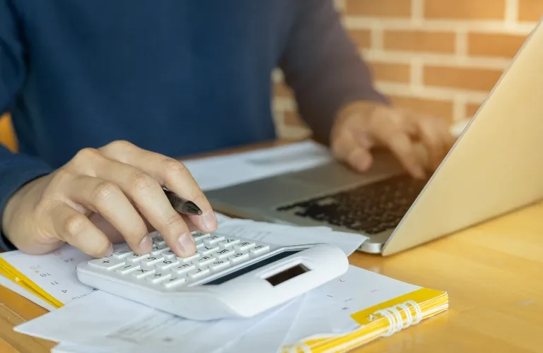 employee man hand calculate on calculator about debt bills pay monthly