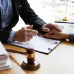 Businessman and lawyer discuss the contract document_s