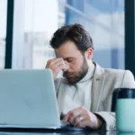 Stress, worry and business man on laptop with online mistake, bad news_s