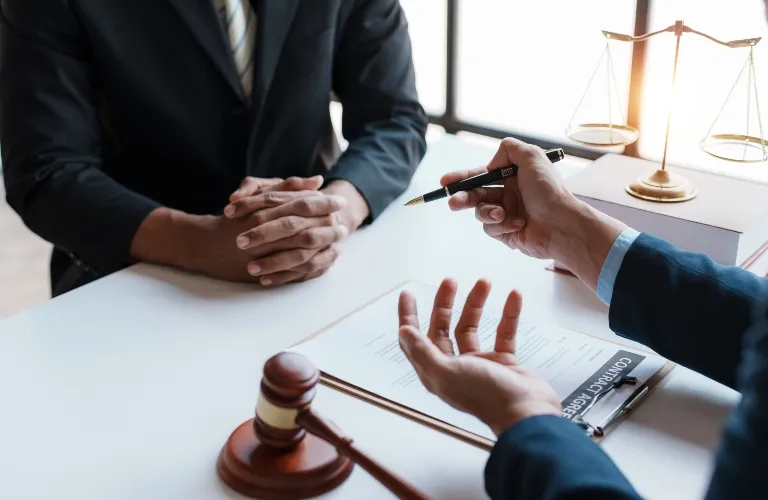 Lawyer and client sign variou financial legal contract