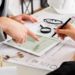 businessmen-analyzing-business-plan-tablet-1024×683